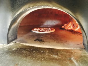 Brick oven pizza cooking